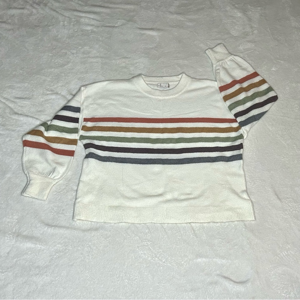 White sweater with colorful stripes